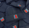 100x Rubber Patch Engineered knit ribbed beanie